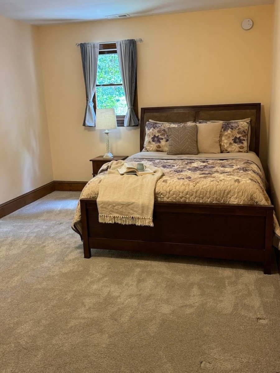 A guest bedroom, after staging