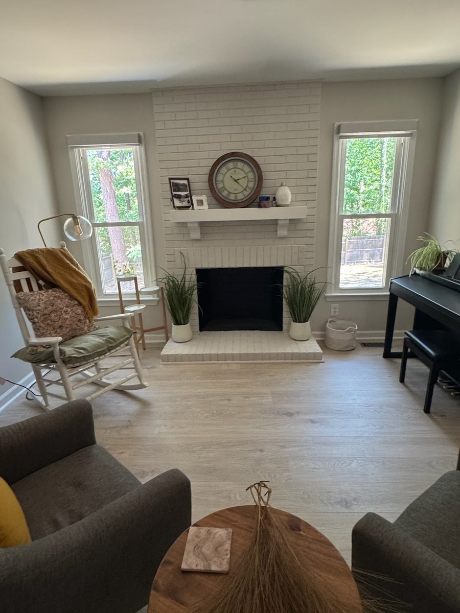 A painted brick fireplace, after staging