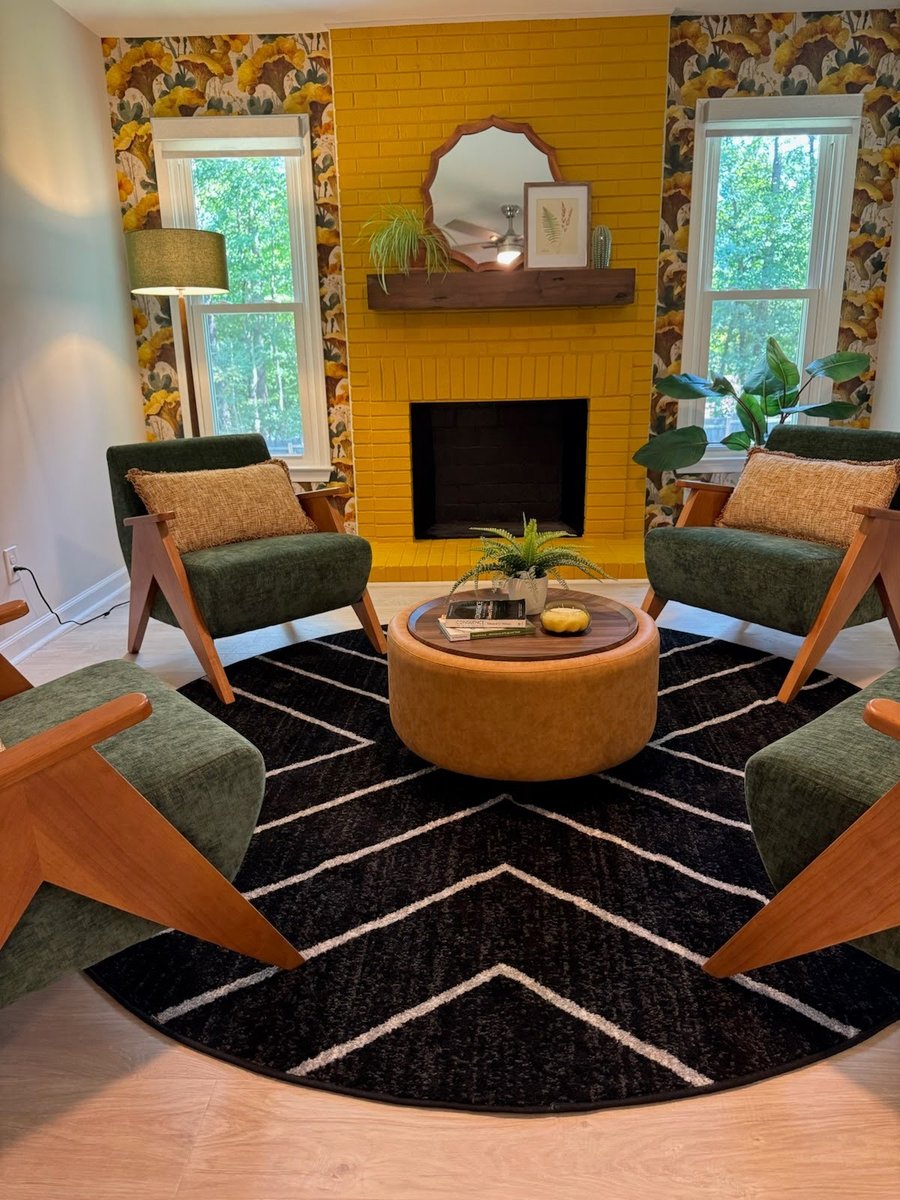 A painted brick fireplace, before staging